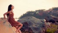 pic for Brunette Girl Posing On Rocks 